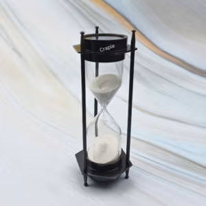 Vintage-style 3-minute hourglass sand timer with a built-in compass, crafted from brass with a black antique finish.
