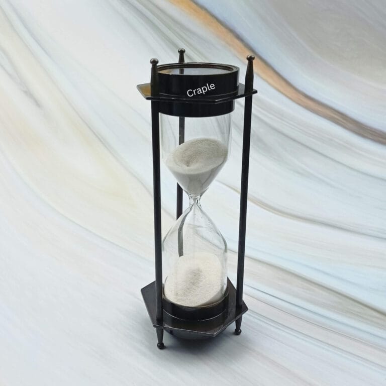 Vintage-style 3-minute hourglass sand timer with a built-in compass, crafted from brass with a black antique finish.