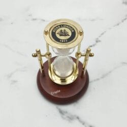 Vintage-style brass hourglass and compass featuring "Ross London 1912" branding on the top plate.
