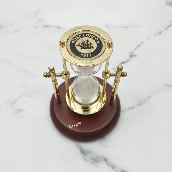 Vintage-style brass hourglass and compass featuring "Ross London 1912" branding on the top plate.
