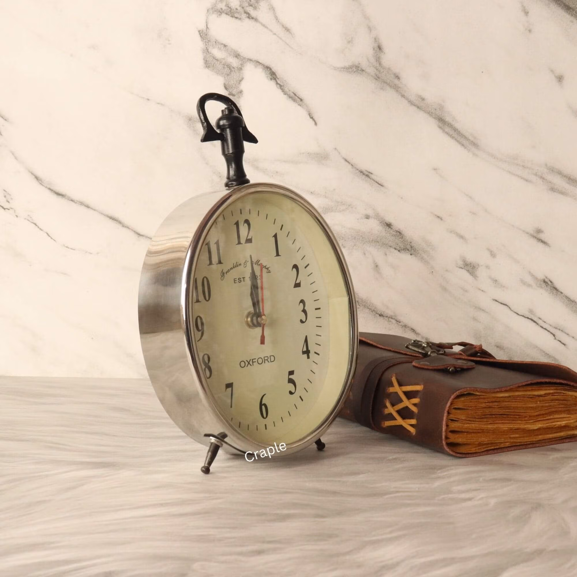 Silver Aluminium Desk & Hanging Clock-2 Angled view of the silver desk and hanging clock, highlighting its polished aluminum casing and sturdy construction.