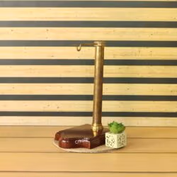 The antique brass gallows-style stand and shaped wooden base for the hanging hourglass.