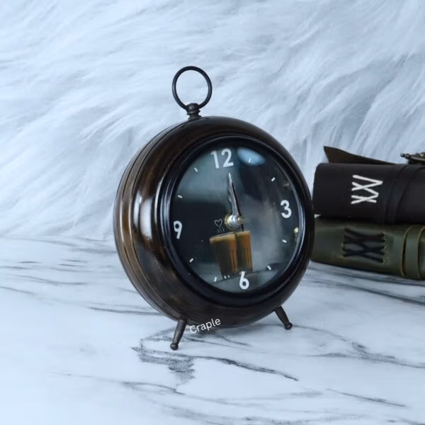 Angled view of the round wooden teacup desk clock, showing its depth and rich antique finish.