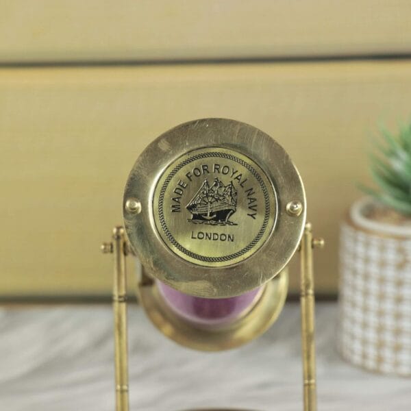 Close-up of the brass end cap showing the "Made for Royal Navy London" historical ship engraving.