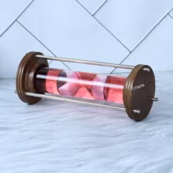 Horizontal view of the red liquid hourglass, focusing on the movement of the pink timer inside the glass tube.