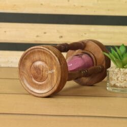 Close-up of the smooth, turned wood base of the handcrafted 5-minute hourglass.