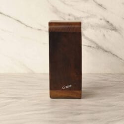 Side profile of the modern wooden hourglass, showing the slim design and rich antique wood polish.